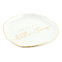 Load image into Gallery viewer, The Trinket Tray - Little Things boasts a slightly wavy edge and metallic gold rim, with &quot;Pretty little things&quot; elegantly inscribed in soft gold cursive at the center, creating a charming ceramic holder for your delicate treasures.
