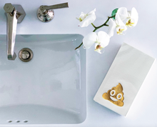 Load image into Gallery viewer, A bathroom sink with a metallic faucet is displayed. To the right, a white orchid in a transparent vase complements luxe Cloth-Like Guest Towels - Year Round Themes, adorned with smiling poop emojis on the counter. The overall aesthetic is clean and minimalistic.
