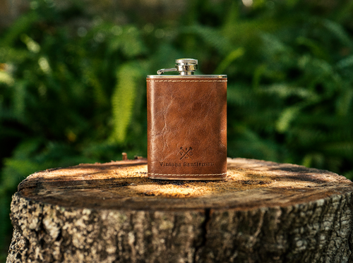 A brown Leather Wrapped Stainless Steel Flask featuring 