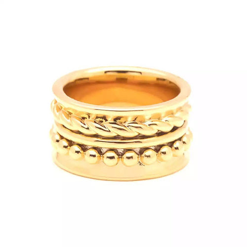 The Taylor Band Ring is an elegant piece crafted from 18k gold plating, featuring three unique bands: a plain top band, a middle band with a braided design, and a bottom band embellished with small round beads. Its polished finish adds extra shine as it is displayed vertically against a white backdrop.