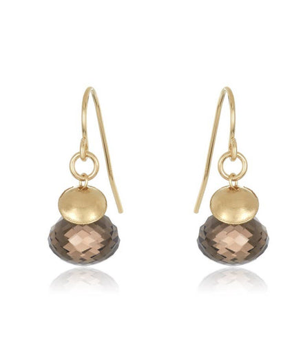 The Just The Thing Earrings feature teardrop-shaped smokey quartz drops paired with small textured gold-filled discs, which boast a matte finish. These elegantly simple earrings, equipped with gold-filled ear wires, are symmetrically displayed against a white background.