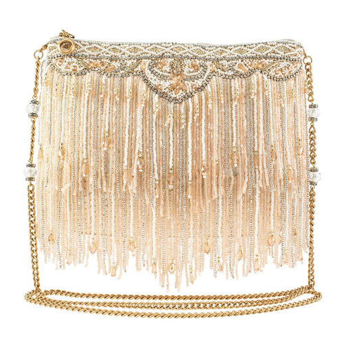 The Sugar Coated Crossbody Handbag is an elegant beige clutch with intricate beading, cascading fringe, gold and silver threads, faceted crystals, and a gold chain strap. Its ornate beadwork adds a luxurious touch to this fashionable accessory.